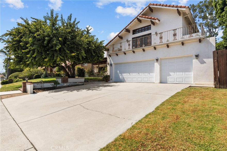 Stunning Spanish Revival estate located in the highly desirable Lower Porter Ranch neighborhood, originally part of the “Tennis Court Estate Homes.” This exceptional custom residence offers timeless Old World Santa Barbara–inspired design and true pride of ownership. Situated on a large, private lot surrounded by mature pine, palm, ficus, and fruitless pear trees, the property features a resort-style yard with a freeform “beach entry” pool, bridges, decks, waterfall, and spa. Perfect for entertaining or relaxing in total privacy. Inside, the home showcases exquisite craftsmanship throughout. The dramatic entry and living room feature limestone floors, a soaring ceiling, and a stunning custom fireplace with an elegant mantle. Oversized arched French doors open to multiple balconies and patios, blending indoor and outdoor living. The formal dining room offers a hand-crafted brick ceiling, while the open kitchen boasts beautiful walnut-stained flooring and quality finishes. The wrought iron and cherrywood staircase leads to a dramatic loft and three spacious upstairs bedrooms, including the primary suite with a large custom balcony and newly remodeled bath. The fourth bedroom (or office) is located downstairs with its own bath, ideal for guests or a remote work space. Imported architectural details—doors, windows, and balconies—were hand-selected and transported from San Miguel de Allende, Mexico, creating a truly one-of-a-kind residence! Additional highlights include a three-car garage and excellent parking! Located near excellent restaurants, entertainment and so much more!