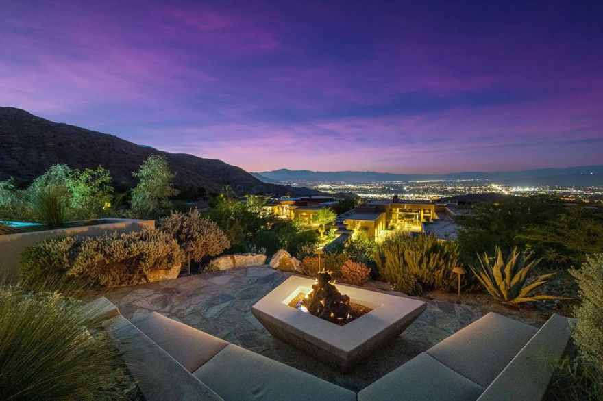 This beautiful contemporary hilltop home is nestled in the exclusive Mirada Estates. The residence is positioned on one of the highest custom lots in Mirada, soaking in panoramic views of the valley below. This 4 bedroom home is in a truly ideal position, surrounded by the beautiful mountains and the Bighorn nature preserve affording tranquility and privacy. The architect, David Prest, created a design that maximizes the spectacular views from a variety of indoor and outdoor living spaces. The entryway into this property is a true wow experience, with glass entry doors exposing the vistas over the beautiful pool and the spectacular valley floor in the distance.The updated and renewed decor by the present owners makes the house look like it was just built. The great room, with its incredible bar, is one of the best places to view the lights of the desert floor at night.The private primary retreat is superb, with a separate area for an office, and a huge elegant bath. The charming attached guest house has a living area and bedroom giving guests their privacy, yet just steps to the main house.The home has a massive owned solar system, large patios in the rear yard and an infinity edge pool. Being sold furnished per inventory.  A benefit of being a homeowner at Mirada Estates are the additional privileges offered at the neighboring Ritz Carlton including reduced dining rates, with spa and fitness privileges..