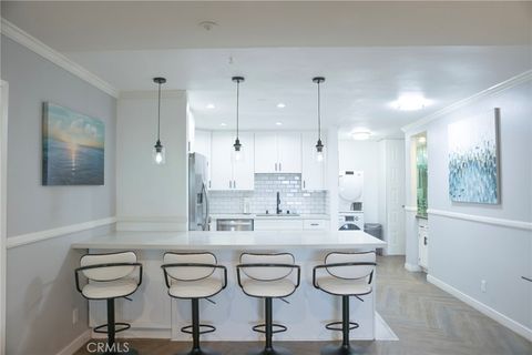 Photo of 200 Mcneil Lane #102, Newport Beach, CA 92663 (MLS # OC25265232)