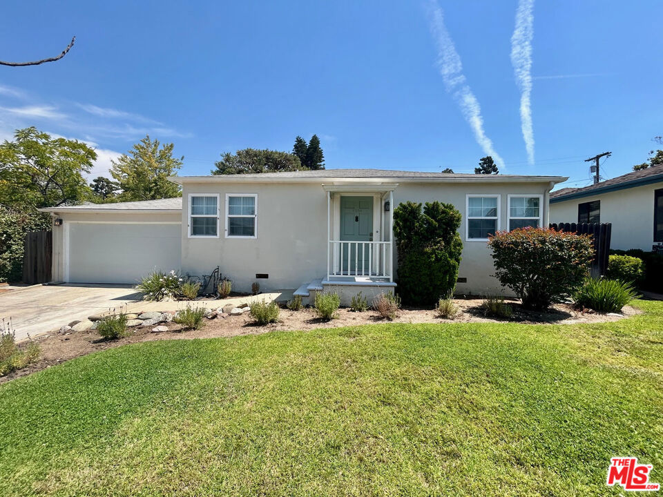 Charming house in a great residential neighborhood of Westside Village! This 2 bed and 1 bath with an open plan feature wood floors in the living room and bedrooms. The spacious kitchen with tile floors has stainless steel fridge and dishwasher, a laundry closet with new front loading washer and dryer, and a dining area. The shared bath has a dual vanity sink and tub/shower combo. Other features include split system a/c, a large landscaped backyard with mature trees, and a spacious 2 car garage. Owner seeking longer term lease.