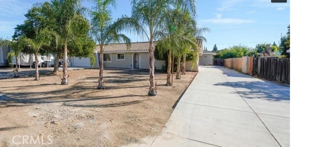 Welcome to 17387 El Paso Rd, a one-of-a-kind property in Madera offering an extraordinary blend of residential comfort, premium commercial-grade infrastructure, and unmatched versatility. Set on a spacious third-of-an-acre lot, this meticulously maintained estate is ideal for contractors, tradespeople, hobbyists, or anyone seeking a unique live/work setup.
At the heart of the property is a massive 2,000 sq ft masonry workshop, professionally built with full permits and nearly $300,000 invested in construction. This high-end facility features a commercial-grade concrete foundation valued at $75,000, full plumbing and electrical infrastructure, a complete bathroom with hot water tank, and six oversized skylights that flood the space with natural light. With dual access for 18-wheelers on both sides, this workshop is fully optimized for logistics, manufacturing, woodworking, metalwork, or future conversion into a secondary dwelling.
For outdoor utility and entertainment, the property features a 3,000 sq ft covered patio, an impressive 20-foot-high covered RV area with room for multiple vehicles, and RV-ready hookups for water and electricity (sewer can be easily added). Ample shaded areas throughout offer both functional storage and relaxing spaces—perfectly suited for Madera’s warm climate.
The 1,150 sq ft main home includes 3 bedrooms and 2 full bathrooms, and has been completely renovated from top to bottom, sparing only the original structure. With a durable Spanish tile roof, this residence is both charming and low maintenance. As the owner’s primary home, it reflects true pride of ownership.
17387 El Paso Rd is truly a rare opportunity—no comparable properties exist in the area. Whether you’re looking to run a home-based business, generate multiple income streams, or simply enjoy the ultimate combination of work and lifestyle, this property delivers unmatched value and potential.