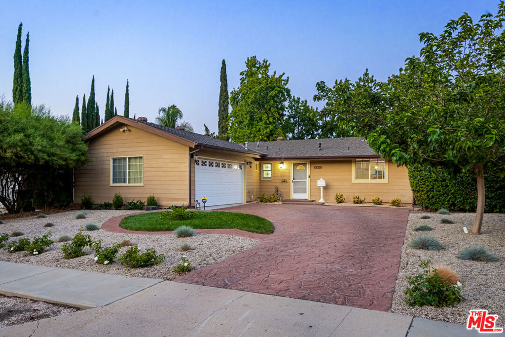 Welcome to this beautifully upgraded 3-bedroom / 2-bathroom ranch-style home, perfectly nestled on one of the largest lots in the neighborhood! With endless potential, this home offers a private, oversized backyard with roughly 1,300 sqft of luxury artificial turf, that's ideal for entertaining and enjoying the Southern California lifestyle. Whether you're dreaming of a future expansion or envisioning the addition of an ADU, the possibilities are truly limitless.Step inside to a tranquil, modern Santa Barbara-inspired oasis where every detail has been thoughtfully curated. The gourmet kitchen features sleek stainless steel appliances, gorgeous granite countertops, and custom cabinetry with newly painted finishes and designer hardware. The open-concept living and dining areas are bathed in natural light and create the perfect flow for family living and entertaining. New luxury vinyl flooring runs throughout the entire home, complementing freshly painted ceilings and walls. Stylish new lighting fixtures enhance the ambiance, while the newer windows ensure plenty of sunlight and energy efficiency. Both bathrooms have been tastefully remodeled with contemporary finishes, each offering a shower-over-tub setup.Enjoy seamless indoor-outdoor living with a spacious patio, complete with a motorized retractable awning (with a wind sensor) for ultimate convenience and comfort. The front yard boasts drought resistant plants with a drip system installed. Additional perks include a built-in electric double oven, 5-burner gas range, and included refrigerator and washer/dryer.Located in a quiet, family-friendly neighborhood, this home is near top-rated schools Hale Middle School, El Camino High School, and Lockhurst Elementary School. You'll also enjoy easy access to the Warner Center, Calabasas Commons, the 101 Freeway, and the beautiful beaches of Malibu.This home offers the perfect combination of space, style, and location. Don't miss out on this wonderful opportunity to own in a prime area schedule your private showing today!