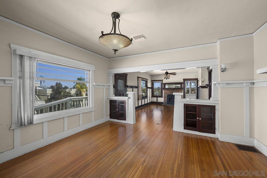 Situated perfectly between North Park & Hillcrest! Must see 2-UNIT property with a fabulous VIEW, situated on a spacious 6,349 SF LOT. The upper-level main home has the most amazing views and exudes character and history with 3bedrooms/2baths, and sunroom. Charming period details throughout such as gorgeous trim and high ceilings. The beautiful lower unit is a 2bd/2ba and boasts modern finishes, a private garden, and a fantastic layout, perfect for rental income or multi-generational living. Detached 1-car garage+2 extra spaces off the alley. Rare off-street parking—a true luxury in this neighborhood! Zoning provides potential for additional units. Prime location—walking distance to the San Diego Zoo, Hillcrest, and North Park. A rare find in one of San Diego’s most vibrant neighborhoods—don’t miss this exceptional opportunity!