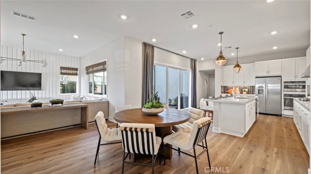 This new two-story home is designed for modern lifestyles. An open-concept floorplan shares the first floor with a secondary bedroom. A spacious covered deck on the first level is ready for outdoor leisure and entertainment. Three additional bedrooms make up the second level, including the lavish owner’s suite with a spa-inspired bathroom and walk-in closet. A two-bay garage at the back of the home provides convenient entry for both guests and residents.