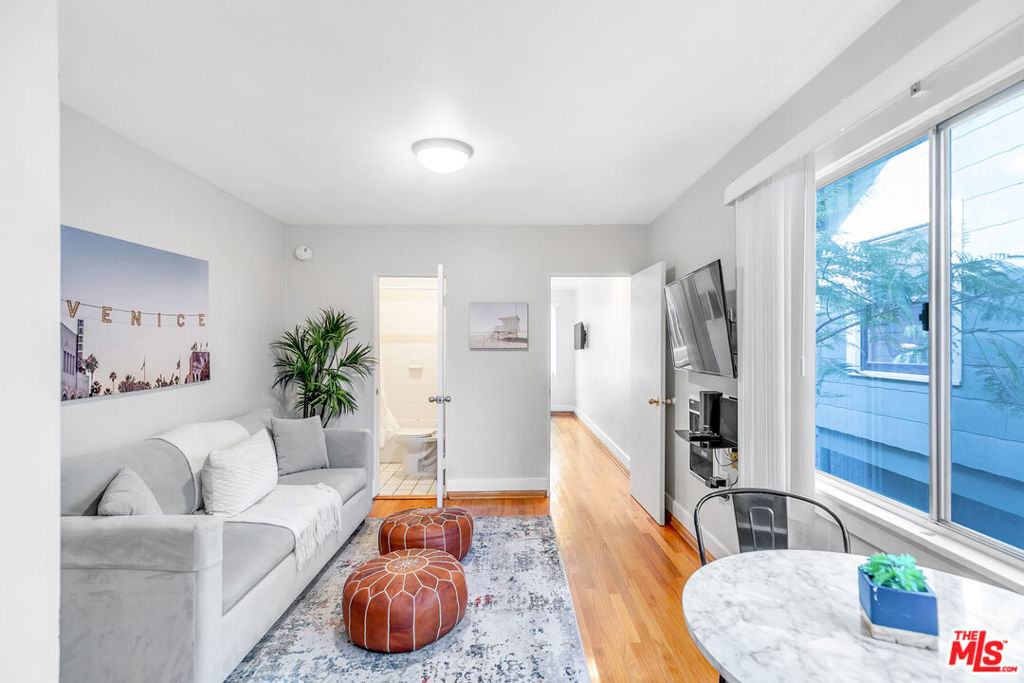 Beach life, but make it steps away! This 1-bedroom, 1-bathroom apartment is so close to the sand, you'll practically wake up to the sound of waves. Fully furnished (or unfurnished, if you prefer), it's ready for you to dive right into the ultimate beachside lifestyle. This bright and airy unit is designed to maximize natural light, with big windows that let the sunshine pour in. Inside, you'll find a luxurious king bed, a cozy pull-out sofa bed for guests, and a layout that's as functional as it is stylish. Everything you need from linens to kitchenware is already here, so you can settle in stress-free. Just imagine strolling out your door and onto the sand it's that close. You'll be living in the heart of Venice, surrounded by its iconic boardwalk, vibrant shops, and trendy cafes. Whether you're catching the sunset, riding a beach cruiser, or just lounging in the comfort of your sunlit apartment, every moment feels like a vacation. Fully equipped with everything you need (including good vibes), this unit is perfect for couples, solo adventurers, or anyone dreaming of beachfront living. Don't wait this rare opportunity won't last long. Call today and claim your place by the ocean!