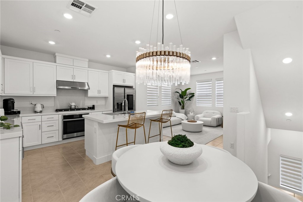 This beautiful DETACHED home in the Rienda Flora Collection of Rancho Mission Viejo offers a wonderful blend of modern living and resort-style amenities with just ONE LOW HOA, just steps from the pool and Rienda Plunge! The open-concept design includes 2 bedrooms + versatile FLEX-ROOM DEN OPTION, and 2.5 bathrooms. The kitchen features quartz counters, a large island, stainless Samsung appliances, recessed lighting, and a walk-in pantry, all seamlessly flowing into the living room and private balcony with views of the POOL and surrounding HILLS. The upper level houses both bedrooms, with the primary suite offering a luxurious bath with dual vanities, a walk-in shower, and a spacious walk-in closet. The second bedroom is also well-appointed, complete with a full bath and a walk-in closet. The flex-room is ideal for a home office and offers access to a wrap-around YARD through sliding glass doors. Other highlights include leased solar with battery and warranty, vinyl plank flooring, plush carpeting, Nest thermostat, Ring doorbell and custom window coverings. Residents of Rancho Mission Viejo enjoy exceptional amenities including the vibrant Ranch Camp, the Rienda Plunge pool, resort-style pools and spas, a variety of fitness centers, tennis and pickleball courts, bocce ball courts, playgrounds, and more. Plus, you'll have access to community farms, coffee shops, fire pits, an arcade, and the nearby Esencia K-8 school. Hilly picturesque Rienda truly offers everything you need for a balanced and fulfilling lifestyle.