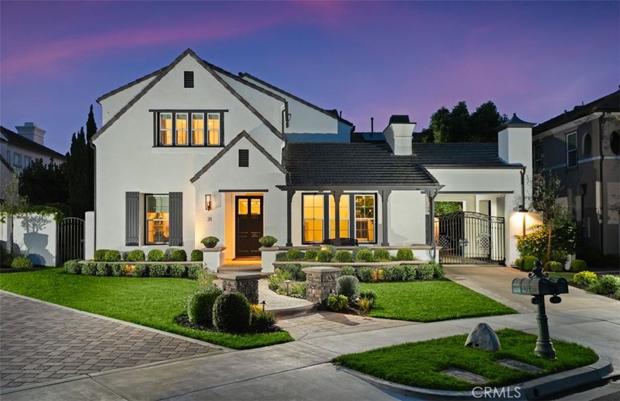 Situated in a private and very quiet section behind the exclusive guard gates of Newport Ridge North, 31 Harcourt exemplifies refined coastal living. This recently reimagined Rivage Plan 4 has been thoughtfully renovated throughout, with nearly every interior detail curated to elevate both comfort and style. Bathed in natural light thanks to its desirable west-facing orientation, the home welcomes you with an airy open-concept design and an abundance of windows that create a seamless indoor-outdoor connection. On the main level, a private office (or optional fifth bedroom) is tucked toward the front of the home for maximum privacy, while the kitchen, family room, and dining area flow effortlessly into the expansive backyard. Ideal for entertaining, the outdoor space features a built-in barbecue island with seating for seven, a covered lounge pavilion, and a generous lawn area—perfect for games, gatherings, or simply enjoying tranquil open skies and sparkling city light views with no rear neighbor. Upstairs, four spacious bedrooms offer well-appointed closets, while the primary suite serves as a private sanctuary complete with a retreat, covered balcony, and a resort-style bathroom. The spa-like bath includes dual vanities, an oversized tub, a walk-in shower, and two generous walk-in closets. A gated porte-cochère leads to a spacious three-car garage, providing both enhanced privacy and a grand sense of arrival. Every element of the renovation—from the flooring and cabinetry to the lighting, hardware, and tile—was hand-selected with care and intention. The result is a cohesive and elevated design palette, blending soft textures and warm tones to create a home that feels both luxurious and welcoming. Special attention was given to the balance of modern refinement and inviting livability, ensuring each space evokes a sense of calm, connection, and effortless elegance. Residents enjoy exclusive access to community amenities, including a lap pool, clubhouse, pickleball courts, tennis and basketball courts, parks, playground, and expansive greenbelts—all within the neighborhood.  With close proximity to world-class shopping, dining, Pelican Hill Resort, award-winning schools, and the 73 Toll Road, this exceptional home blends elevated design with everyday livability in one of Newport Coast’s most sought-after enclaves.