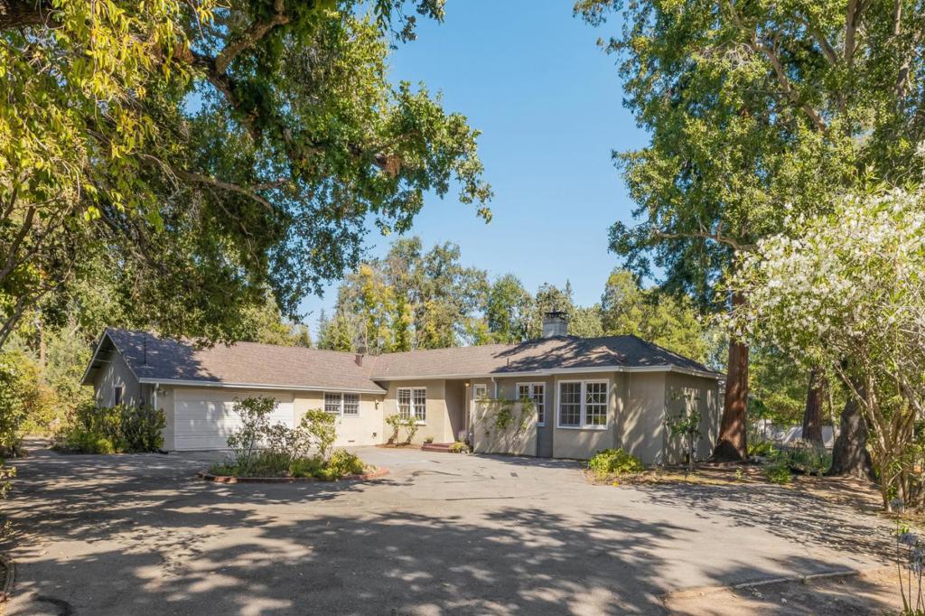 Substantial price reduction. 285 Camino Al Lago presents a unique opportunity to expand, renovate, or build new on an approximately 1.25 acre parcel in prime West Atherton. The private and serene setting is sheltered from the street and showcases majestic heritage trees. The home falls in the coveted Las Lomitas School District and also offers outstanding private schools. Enjoy a close proximity to downtown Menlo Park and Palo Alto, the Menlo Circus Club, Stanford University, and Sand Hill Road. A short 20 +/- minute drive to both San Francisco and San Jose International Airports.
