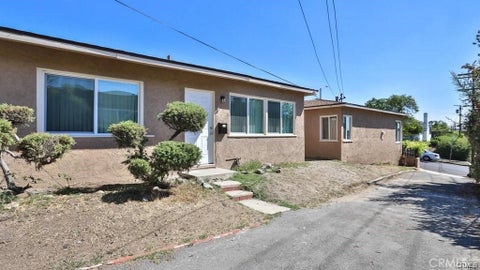 Photo of 1877 S Cloverdale AVE, Los Angeles, CA 90019 (MLS # RS26192898)