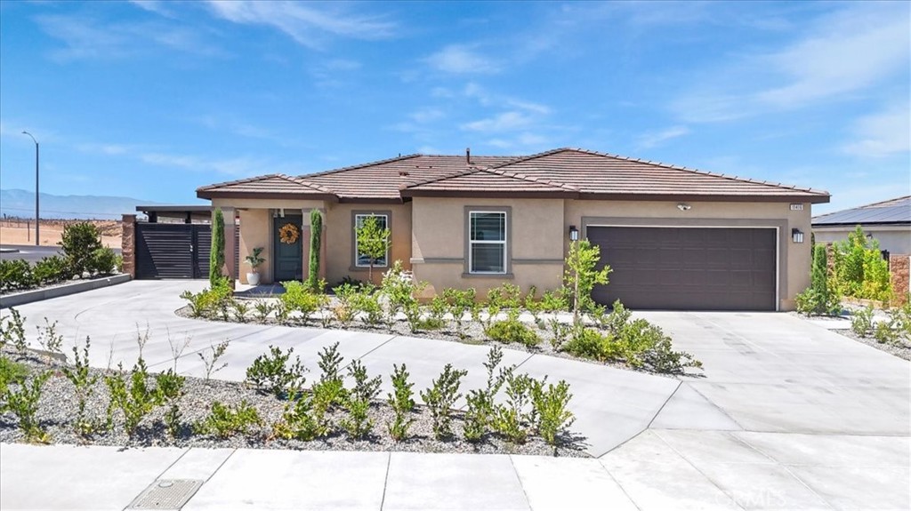 Blt. in 2024 with lots of UPGRADES without the wait! You would pay much more with the builder to have all of these luxurious upgrades! ****Paid Solar!!****$20,000 in Extended concrete all around the house including an extra covered parking area with an AlumaWood stylish gate that gives the house the latest trending look! 18 x 50 back concrete deck that continues around both sides of the house and across the front. Landscaping and irrigation and drip system. Complete privacy on this oversized corner lot, secured by a big beautiful brand-new 6 foot block wall--no one will ever build behind you! Upgraded kitchen with Extended bottom cabinets and countertops with a wine refrigerator and floating shelves. Custom mosaic tile as kitchen backsplash. Double sink vanity in the primary suite and the sinks and the shower have never been used!! Blt. in bookshelves in one bedroom and floating shelves in kitchen and den. Metal overhead shelves in garage. Custom decorator wood wall on one wall in the living room. Upgraded light fixtures in Living room and dining room. Extra interior outlets, for total convenience! Upgraded front porch light fixtures. Exterior Security Camera and motion detection floodlights. Custom window shades. No money was spared in making this home complete!! All of the beautiful upgraded furniture can also be purchased! Just like a model home! You must see to appreciate!! Call me for a private tour. Agents please see private comments.