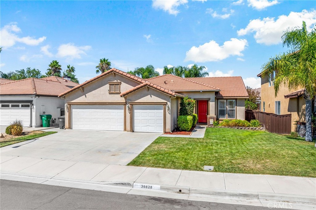 This beautifully maintained 3 bd/2 ba (plus a 4th office, den, or 4th bedroom) residence offers an open-concept floor plan that seamlessly connects the spacious kitchen, dining, and family room areas—perfect for entertaining or relaxing with loved ones. The kitchen features a walk-in pantry and overlooks the cozy family room, making it the heart of the home. Step inside through the main entrance and you'll find a versatile office space with a stylish barn door, ideal for remote work. Most rooms are adorned with newer blinds, and the flooring throughout is durable laminate vinyl plank, while the bedrooms feature newer carpeting for added comfort. The primary suite is a true sanctuary, boasting a renovated bathroom and a large walk-in closet with custom shelving. Every bedroom is equipped with ceiling fans for year-round comfort, and as a bonus, all mounted TVs and their hardware are included in the sale. Enjoy easy indoor-outdoor living with sliding doors from the dining area as well as the master, that lead to two covered patios, shaded by Alumawood structures—ideal for weekend gatherings or quiet evenings. The backyard is a serene retreat, complete with a charming pink lemon tree.
Additional upgrades include a brand-new water heater (just 3 months old), ensuring peace of mind and energy efficiency. Lovely clean neighborhood walking distance to schools, close to shopping and growing community. NO HOA AND LOW TAXES!!!!