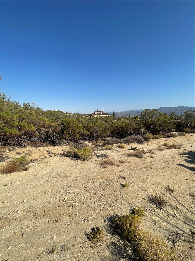Welcome to nearly 10 acres of prime land in Southern California’s stunning Anza Valley—just 400 feet from the iconic Pacific Crest Trail and backed by protected BLM land and Anza-Borrego State Park. This rare gem offers million-dollar views, complete privacy, and a setting that feels worlds away from the hustle and bustle. Surrounded by untouched chaparral and clean mountain air, this peaceful property is perfect for hiking, agriculture, or creating your dream retreat. Enjoy starlit skies at night, gentle breezes during the day, and the peace of mind knowing that your views are protected forever with no future development behind you. The land gently rises into natural tiers—ideal for fruit trees, vineyards, gardens, or a panoramic hilltop home. With recently graded road access, you can easily envision building a private getaway or launching a one-of-a-kind Airbnb experience. Sitting at 4,300 feet elevation, you’ll experience four mild, beautiful seasons—perfect for weekend escapes or full-time mountain living. Stargazers and nature lovers will fall in love with the zero light pollution and direct trail access. Whether you’re dreaming of a self-sustaining homestead, a peaceful weekend cabin, or a unique income-producing retreat, this land is full of potential—and ready to become something truly special.