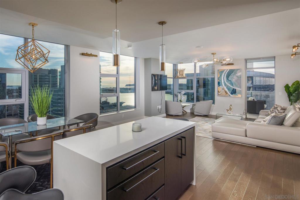 Available January 20, 2026!  GORGEOUS FULLY FURNISHED PENTHOUSE WITH PANORAMIC WATER VIEWS! Experience elevated urban luxury on the 34th floor of Savina, where floor-to-ceiling windows showcase stunning west-facing views of the San Diego Bay and Pacific Ocean. The gourmet kitchen features Thermador stainless appliances, a cabinet-front refrigerator, and a massive center island perfect for entertaining. The spacious primary suite includes a walk-in closet and an ensuite bath with a quartz double vanity and frameless glass shower. Enjoy nightly sunsets and breathtaking views from your oversized private terrace — welcome home to #3405, where sophistication meets the San Diego skyline. Real refined luxury on the 34th floor of Savina! Built by Italian Architect Bosa! Enjoy unparalleled west-facing views of the San Diego Bay and Pacific Ocean from sprawling windows. The modern gourmet kitchen boasts stainless Thermador appliances, cabinet-front refrigerator and huge center island. Spacious master bedroom includes a sizable walk-in closet and ensuite bath complete with quartz double vanity and upgraded frameless shower enclosure. Imagine yourself with nightly sunsets on the oversized private terrace. This fabulous 34th floor condo espouses an array of high-end contemporary touches, setting it apart from anything like it. Enjoy expansive views of San Diego Bay, Point Loma and the Pacific Ocean from any of the home’s many windows. Enjoy a cup of coffee or an evening glass of wine, stepping out onto the west-facing private terrace is a luxurious retreat. Meal preparation is an equally enjoyable experience in the fabulously open modern kitchen, complete with sleek paneled refrigerator, designer cabinetry pulls, Thermador cooking appliances, custom tile backsplash, and an enormous center island with waterfall edge. The spacious master suite features a huge  walk-in closet and incredible modern bathroom with a large rain shower, porcelain tile floors, and quartz dual vanity. A  large secondary bedroom includes fabulous west-facing views and organized closet. Both bathrooms feature upgraded frameless glass shower enclosures and Grohe faucets and features. A large laundry room with side-by-side LG front-loading machines makes for convenient urban living. Savina by Bosa is one of San Diego’s newest and most luxurious high rises and steps away from Little Italy, one of Forbes Best Neighborhoods. The community’s first-class amenities include amazing outdoor pool and spa, indoor gym, steam room & sauna, dog wash and outdoor pet park, bicycle repair room, and club house/game room and BBQ area for entertaining. Literally steps away from Waterfront Park, you can enjoy an array of concerts and outstanding community events. And when it’s time to get away, take advantage of proximity to the airport, cruise terminal, and train & trolley stations. Whether winding down on the private balcony or making your way to one of Little Italy’s countless renowned restaurants, city living is beautiful at Savina.