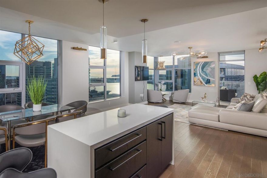 Available January 20, 2026!  GORGEOUS FULLY FURNISHED PENTHOUSE WITH PANORAMIC WATER VIEWS! Experience elevated urban luxury on the 34th floor of Savina, where floor-to-ceiling windows showcase stunning west-facing views of the San Diego Bay and Pacific Ocean. The gourmet kitchen features Thermador stainless appliances, a cabinet-front refrigerator, and a massive center island perfect for entertaining. The spacious primary suite includes a walk-in closet and an ensuite bath with a quartz double vanity and frameless glass shower. Enjoy nightly sunsets and breathtaking views from your oversized private terrace — welcome home to #3405, where sophistication meets the San Diego skyline. Real refined luxury on the 34th floor of Savina! Built by Italian Architect Bosa! Enjoy unparalleled west-facing views of the San Diego Bay and Pacific Ocean from sprawling windows. The modern gourmet kitchen boasts stainless Thermador appliances, cabinet-front refrigerator and huge center island. Spacious master bedroom includes a sizable walk-in closet and ensuite bath complete with quartz double vanity and upgraded frameless shower enclosure. Imagine yourself with nightly sunsets on the oversized private terrace. This fabulous 34th floor condo espouses an array of high-end contemporary touches, setting it apart from anything like it. Enjoy expansive views of San Diego Bay, Point Loma and the Pacific Ocean from any of the home’s many windows. Enjoy a cup of coffee or an evening glass of wine, stepping out onto the west-facing private terrace is a luxurious retreat. Meal preparation is an equally enjoyable experience in the fabulously open modern kitchen, complete with sleek paneled refrigerator, designer cabinetry pulls, Thermador cooking appliances, custom tile backsplash, and an enormous center island with waterfall edge. The spacious master suite features a huge  walk-in closet and incredible modern bathroom with a large rain shower, porcelain tile floors, and quartz dual vanity. A  large secondary bedroom includes fabulous west-facing views and organized closet. Both bathrooms feature upgraded frameless glass shower enclosures and Grohe faucets and features. A large laundry room with side-by-side LG front-loading machines makes for convenient urban living. Savina by Bosa is one of San Diego’s newest and most luxurious high rises and steps away from Little Italy, one of Forbes Best Neighborhoods. The community’s first-class amenities include amazing outdoor pool and spa, indoor gym, steam room & sauna, dog wash and outdoor pet park, bicycle repair room, and club house/game room and BBQ area for entertaining. Literally steps away from Waterfront Park, you can enjoy an array of concerts and outstanding community events. And when it’s time to get away, take advantage of proximity to the airport, cruise terminal, and train & trolley stations. Whether winding down on the private balcony or making your way to one of Little Italy’s countless renowned restaurants, city living is beautiful at Savina.