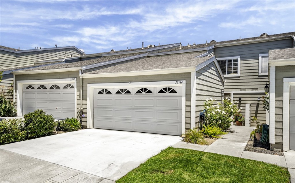 Your coastal lifestyle awaits just 1.5 miles from Dana Point Harbor! Nestled in the gated Marinita Townhomes, this expansive 1,956 sq ft residence offers the largest floor plan in the community with 3 bedrooms, 2.5 baths, and a serene setting with valley views, ocean breezes, and complete privacy from road noise. Step inside to soaring ceilings, walls of windows, and a bright, open layout. The living room with a cozy gas fireplace flows seamlessly to a spacious patio perfect for indoor-outdoor entertaining; an additional nook can be used as a desk space, bar, or display area. The formal dining area is conveniently located between the living room and kitchen, offering a comfortable space for hosting meals and gatherings. The kitchen features newer appliances and a flexible room that can be used for a breakfast nook or your home office. Upstairs, the private primary suite boasts a generous walk-in closet, oversized double vanity, soaking tub and separate shower. Two additional bedrooms share a full bath and linen storage cabinets in upstairs hallway. One is oversized and can easily double as a second primary. The home has been fully repiped and includes interior laundry with ample storage. The refrigerator, washer, and dryer are included! This location is unbeatable with the free trolley stopping just outside the gate, offering quick access to Dana Point’s best beaches and easy connection to other trolleys serving nearby coastal destinations like Laguna Beach, San Clemente, San Juan Capistrano, and Laguna Niguel - spend the day exploring! Exciting developments continue in the Lantern District as well as the Dana Point Harbor with its $600M+ revitalization project that promises new waterfront dining, boutique shopping and a world-class marina, ensuring strong future equity growth. Priced competitively with the option to assume the seller’s low-rate FHA loan at 5.75%. This is your chance to customize your dream home, move in now and secure your place in one of south Orange County’s most rapidly evolving coastal neighborhoods.