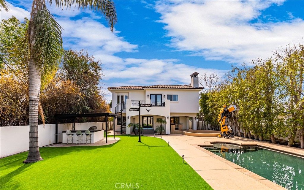 Welcome to luxury living at its finest! This exquisite 5 bedroom ,6-bathroom gated compound in the prestigious Walnut Acres, offers a harmonious blend of sophistication and comfort. Step into a world of opulence as you explore the expansive living spaces, perfect for both intimate family gatherings and grand entertaining. The heart of this home is the chef's kitchen, equipped with state-of-the-art appliances, custom cabinetry, and a center island - a culinary enthusiast's dream. Five generously sized en-suite bedrooms provide comfort and tranquility. The master suite is a true sanctuary, boasting a spa-like bathroom and a private balcony overlooking the manicured grounds. The compound extends its luxury beyond the interiors with one structure that can be used and a fully equipped recording studio/guest house with a conference room. Discover a private retreat with a sparkling pool spa, outdoor movie theater, and putting green that creates the perfect setting for leisure and entertainment. Nestled in the coveted Walnut Acres neighborhood, this compound provides the perfect blend of privacy and convenience. Enjoy easy access to top-rated schools, shopping, dining, and entertainment. Every detail of this home showcases exceptional craftsmanship and attention to detail, ensuring a residence that is both timeless and luxurious.