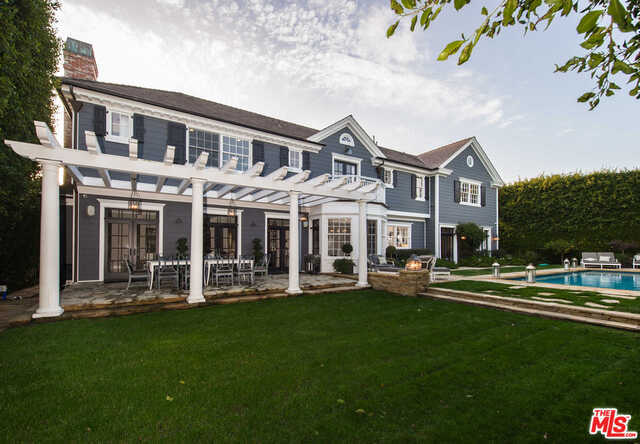 Contemporary Ken Ungar traditional in the heart of Pacific Palisades, just a short distance from the beach. Features picturesque French windows, custom molding, beadboard and wainscot paneling, and hardwood floors throughout. This Crestron smart home is nearly 8,000 square feet, including grand foyer, formal living room with coffered ceilings, family room, plush master retreat, guest bedrooms, media room and gym. Luxurious bathrooms include a dry sauna, two steam showers and an outdoor shower. The gourmet kitchen features a Sub-Zero built-in refrigerator, Viking appliances, breakfast nook, center island, bar and wine room. Gorgeous outdoor space surrounded by lush privacy hedges, including a stunning entryway fountain, patio with charming pergola, pool/spa and grassy yard. This marvelous estate is perfect for entertaining with all the best qualities of California living.