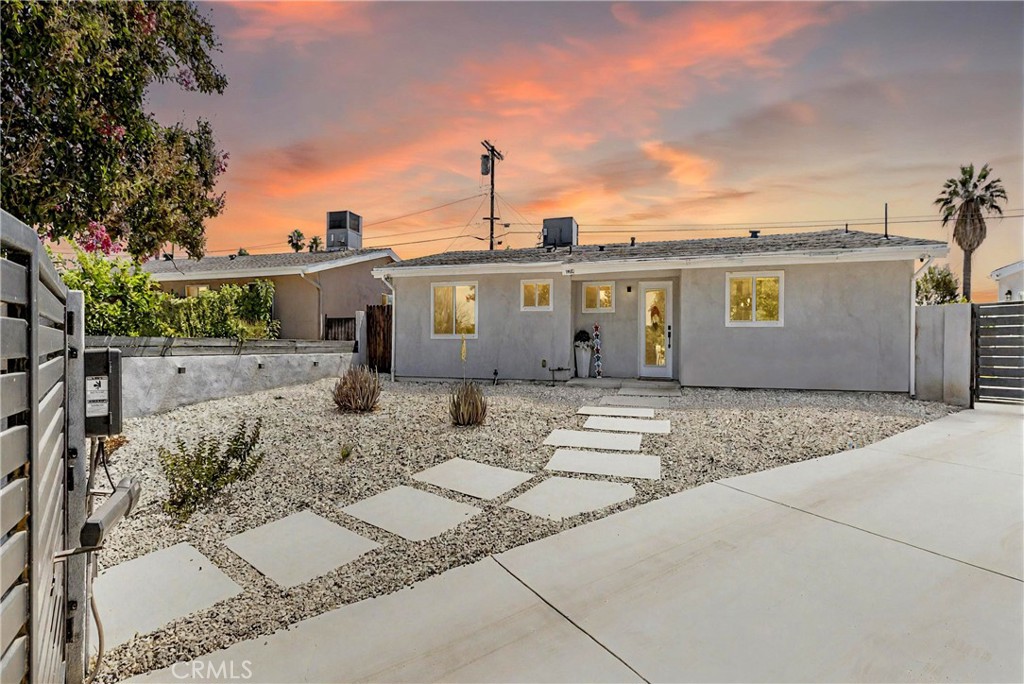 Welcome to 16652 Itasca Street – Nestled at the end of a quiet cul-de-sac in the heart of Northridge, this beautifully updated residence combines modern luxury, everyday comfort, and thoughtful upgrades in a peaceful, private setting. A custom metal front gate—powered by dual LiftMaster motors—opens to reveal a fully enclosed and upgraded oasis. The entry is striking, with a smart-locked metal front door framed by lush landscaping, decorative rock work, and solar-lit vinyl fencing for added charm and security. Inside, you’ll find a reimagined interior with high-end finishes throughout. Recessed lighting with dimmers, custom blackout blinds, and a dramatic black YSL tile fireplace in the living room set the tone for both elegance and comfort. The open-concept kitchen boasts all-new cabinetry, sleek appliances including a range hood and dishwasher, a built-in wine/drink fridge, and a hidden washer/dryer nook with bonus counter and storage space. Both bathrooms have been fully remodeled with stylish tubs, toilets, and upscale fixtures, while the primary suite includes its own en-suite bath—offering a private retreat with contemporary flair. Comfort and efficiency come together with a Nest-controlled HVAC system, commercial-grade water heater, updated carbon monoxide/smoke detectors, and smart home features throughout. Step outside to a backyard designed for entertaining and future potential: brand-new concrete with decorative grass inlays, a pergola-covered lounge area behind the garage, and a Tesla charger already installed. The spacious backyard offers endless possibilities—whether you're dreaming of a pool, lush garden, or building an ADU for rental income, extended family, or a private workspace. The detached garage has been finished with epoxy flooring and recessed lighting, making it perfect for a home gym, studio, or future conversion. Additional highlights include: New electrical panel and meter, partial copper plumbing upgrade, and smart irrigation system and landscaping enhancements. This turn-key home delivers premium finishes, functional smart upgrades, and future expansion potential—all in one of Northridge’s most desirable neighborhoods.