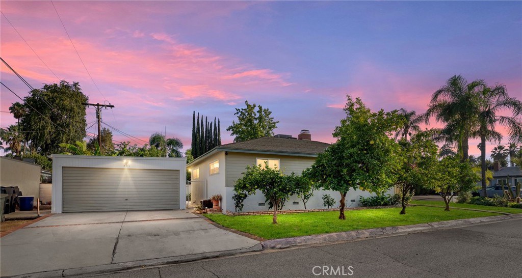 South Redlands, Turnkey single story three bedroom home with a detached two car garage and no HOA - minutes from downtown, Alberstons, and the University exit! Tucked in the back of the beloved Lemon Lime streets, this 1950s ranch has been extensively upgraded.  Enter into the living room, flooded with light on two sides from large windows, and you're greeted my a brick fireplace and new Pergo flooring throughout. The updated kitchen features white cabinets and quartz countertops - all appliances are included.  The bathroom has just been rebuilt, and features a brand new vanity, light fixtures, and mirror. The entire home was just professionally painted inside and out. A section one termite clearance was also completed.  Windows are dual pane.  The private, low maintenance backyard is fenced, and accessible directly from the attached two car garage. The front and side yard features several producing fruit trees.  Excellent location, just off of Cypress Ave but on a quiet street.  It's easy for downtown or the freeway.  Excellent Redlands schools, walkable to Redlands High School.