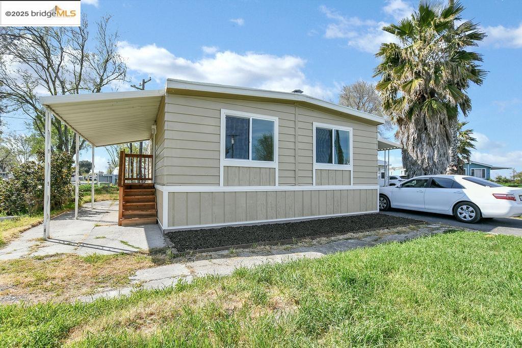 Affordable Home Alert!!! This remodeled double wide mobile home is located in the heart of the Delta waterways within Santiago Island Village Family mobile home park. The exterior skirting is new, new double pane windows, new flooring, new interior and exterior paint, new plumbing system, new heater, textured interior walls, 6 panel interior and exterior doors. The kitchen has a complete facelift with decorator cabinetry, stainless steel sink, decorator faucet, granite counters, beautiful glass tile backsplash, gas stove, and refrigerator. The spacious bathroom features a new designer vanity. There are entry steps from the covered left patio, parking garage, or the primary bedroom. This is a great opportunity to go from tenant to homeowner. A refreshing change from urban noise and smog, this peaceful community has several restaurants within a 5-10 minute drive and is centrally located between the cities of Oakley and Brentwood where all major shopping can be found. Spacious lots, quiet streets, rustling trees and large grassy areas all add to the ambiance and country atmosphere. Mobile home park is located across the street from million dollar properties. Fireplaces: NO