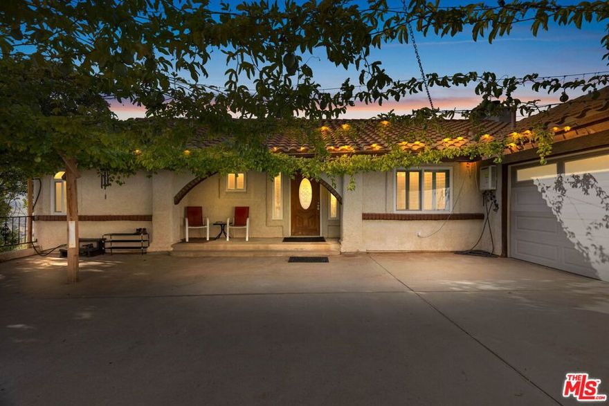 Welcome to a One-of-a-Kind Two-Story 3BR/2.5BA Home on 3.6 Acres with Lake Mathew Views, No HOA, Low Taxes, Updated Interior - Experience comfort, privacy, and natural beauty in this one-of-a-kind two-story home set on a sprawling 3. 6-acre lot overlooking Lake Mathew. Designed with an open floor plan and views from every room, this home maximizes light, space, and stunning scenery. The interior has been refreshed with new flooring and new interior paint, creating a clean, modern, and move-in-ready feel. The spacious living area features a beautiful fireplace and flows seamlessly to the patio, where you can enjoy breathtaking sunrises and sunsets over Lake Mathew perfect for relaxing mornings or serene evenings. The open layout flows naturally into the dining area and kitchen, making entertaining effortless. Upstairs, the private primary suite offers generous space and tranquil views, while two additional bedrooms downstairs provide flexibility for family, guests, or office use.  A versatile bonus room downstairs provides extra space that can be used as an office, game room, additional living room, or a fun hangout area for kids. Every room in the home captures the beauty of the surrounding landscape. With 2.5 baths, the home offers convenience and comfort for modern living. Outside, enjoy fruit trees including pomegranate, lemon, and passion fruit. The 3.6-acre lot also has room to build a second home or add mobile homes, ideal for multigenerational living, guest housing, or rental opportunities. The natural elevation enhances the lake and panoramic sunrise and sunset views, providing peace and privacy throughout the property. Additional highlights include no HOA, giving you freedom over your land, and low taxes, offering valuable long-term savings. This one-of-a-kind property will not last long - a truly exceptional home combining modern updates, versatile living spaces, expansive acreage, and stunning views from every room.