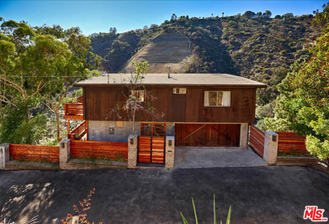Completely remodeled and ready to go! Located at the end of a dead-end street in the Hollywood Hills this mountain hideaway is the perfect retreat for those looking for privacy and a view. Stunning white oak hardwood floors throughout, this spacious and well designed 3 bedroom, 2 bath home features over 1,300 sq. ft. of living space plus studio space. A large comfortable master bedroom and tastefully appointed master bathroom, great closet space and lots of natural light. Enjoy the classic California open floor plan where the kitchen, dining and living areas all enhance the at home experience. Wrap around balconies with Canyon and City views. Stainless steel appliances, brand new cabinets and fixtures. Two additional bedrooms, one perfect for a home office and another designer bathroom. Close to the World Famous Sunset Strip, Beverly Hills, Hollywood & Highland, Studio City and surrounding Studios. Easy access to freeways and the Bob Hope Airport.