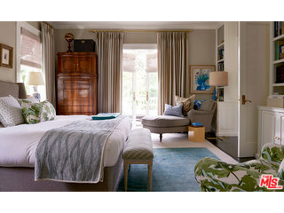 1920's Italianate Estate located in the flats of Beverly Hills, featured in Architectural Digest. Manicured gardens with fountains provide the backdrop to the grand foyer entrance of stenciled wood flooring & finial staircase. Formal living & dining flank, both with voluminous apertures & access to the outdoors. Library with bar, custom chef's kitchen with joining breakfast/entertainment room. Master suite with bath and walk-in closet. Threes additional bedroom suites with baths. Second story outdoor patio terrace. Wine cellar and laundry. Private & secluded backyard with pool and spa. Guest house with bedroom, bath, living room & kitchenette. Outdoor logia, al fresco cooking with bbq & pizza oven. See private remarks.