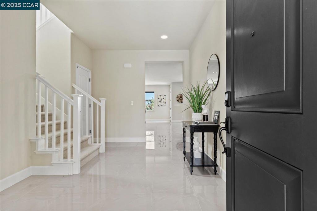 Stunning 4-Bedroom Home with Views & Upgrades Welcome to this beautifully upgraded 4-bedroom, 3.5-bath home built in 2017, located on the desirable Benicia/Vallejo border. Enjoy privacy with no rear neighbors and sweeping views from the primary suite and backyard. This spacious 2-story home features an open-concept layout, a chef’s kitchen with stainless steel appliances and a large island, plus an adjacent entertainment room and custom indoor/outdoor lighting—perfect for hosting. A full bedroom and bath on the main floor add flexibility for guests or multi-gen living. Relax in the spa-like primary suite with a soaking tub, walk-in shower, and generous closet. Outdoors, enjoy low-maintenance landscaping, stamped concrete and beautiful views. Low HOA covers front yard maintenance. Close to shopping, dining, and SF ferry/transit—this one checks all the boxes!