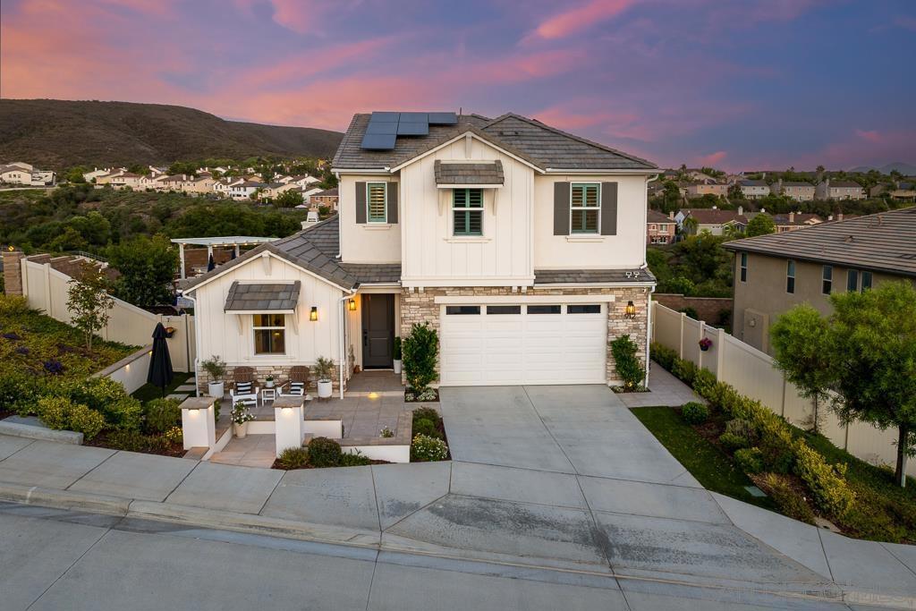 FULLY CUSTOM SKYLARK HOME ON A LARGE, ELEVATED LOT WITH VIEWS! Every inch of this 2022 home has been curated, renovated, designed, and perfected with over $365K in post-builder upgrades. Phenomenal floorplan with full, attached ADU and downstairs primary bedroom. Designer yard featuring a California room, built in barbecue with quartz counters & Pergola, gorgeous porcelain tile flooring, fruit trees, garden, fountain, timed lighting. No neighbor to the side and back! 20 foot high ceilings, owned... solar, Grande Goldin LVP flooring, crown molding, encased windows and doorways, wood shutters, high end ceiling fans, built in closets, custom lighting. Custom barn doors with frosted glass, stunning tile backsplashes, Serena & Lilly wallpapered spaces, and thoughtful, stylistic touches EVERYWHERE. Apollo sliding screen doors throughout; motorized shade at California room. If you think the pictures are gorgeous, you should see this home in person! You must experience it to truly appreciate its splendor. Enjoy nearby Skylark amenities, including trails, park, & bocce ball. Close to the every expanding San Marcos medical hub, Cal State San Marcos, the Sprinter trolley, a variety of private schools, retail...this home is primed for continued appreciation in the years ahead.