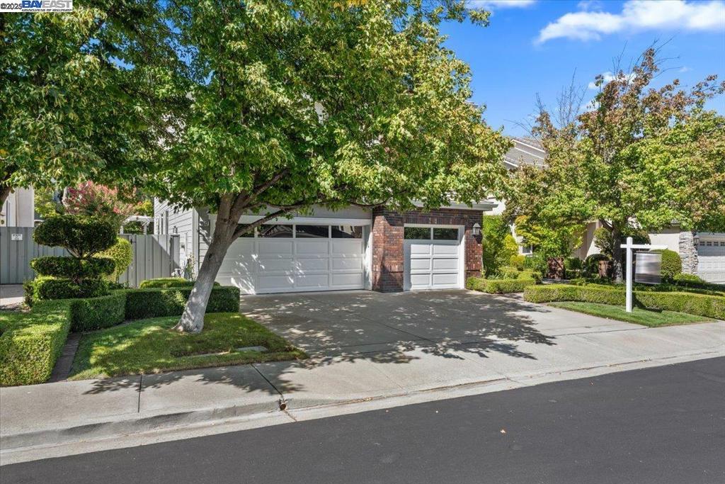 Welcome to this beautiful 4-bedroom, 3-bath home tucked away in a desirable court location with a private yard. Step inside to soaring volume ceilings in the formal living and dining rooms, creating an open and airy feel. The kitchen and family room combo is ideal for entertaining, featuring a spacious center island, rich maple cabinetry, and GE Profile appliances. A full bedroom and bathroom on the first floor offer convenience for guests or multigenerational living. Upstairs, you’ll find generously sized bedrooms, including a luxurious primary suite with a walk-in closet, dual sinks, and plenty of natural light. Outside, enjoy your own private retreat with a built-in barbecue island and professionally landscaped yard—perfect for gatherings or simply relaxing.