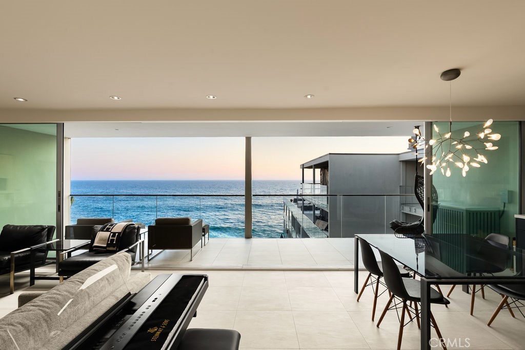 With unrivaled, front-facing ocean views, this rare top-floor home in the newly reimagined Laguna Sands embodies coastal resort living at its finest. Following a recent multi-million-dollar transformation, Laguna Sands now offers one of the most exclusive beachfront lifestyles in Southern California, with direct beach access, an oceanfront pool, expansive sun decks, and elegant common areas for entertaining. This two-bedroom, two-bath residence is fully updated with a refined, contemporary aesthetic. Light pours in through large windows, sliding doors, and skylights, highlighting tiled floors and a breezy, sophisticated ambiance. The efficient layout connects living, dining, and kitchen spaces, all framed by unobstructed ocean and whitewater views that make you feel suspended directly above the waves. Enjoy sunsets from the large balcony, living room and kitchen, which features stainless steel appliances including a Sub-Zero refrigerator, and a generous island perfect for casual dining or entertaining. Both baths are spa-inspired, with walk-in showers, bench seating, and designer finishes. Additional highlights include ceiling fans, a Miele washer and dryer in unit, and abundant bedroom storage. Just steps from your door, explore miles of pristine sandy beaches, award-winning restaurants, charming cafés, shops, and renowned art galleries. The building’s gated entry, subterranean parking, elevator access, and prime location next to the Surf & Sand Resort further elevate the experience. Here, every day feels like a five-star escape — yet you’ll know it’s home, and it's yours.