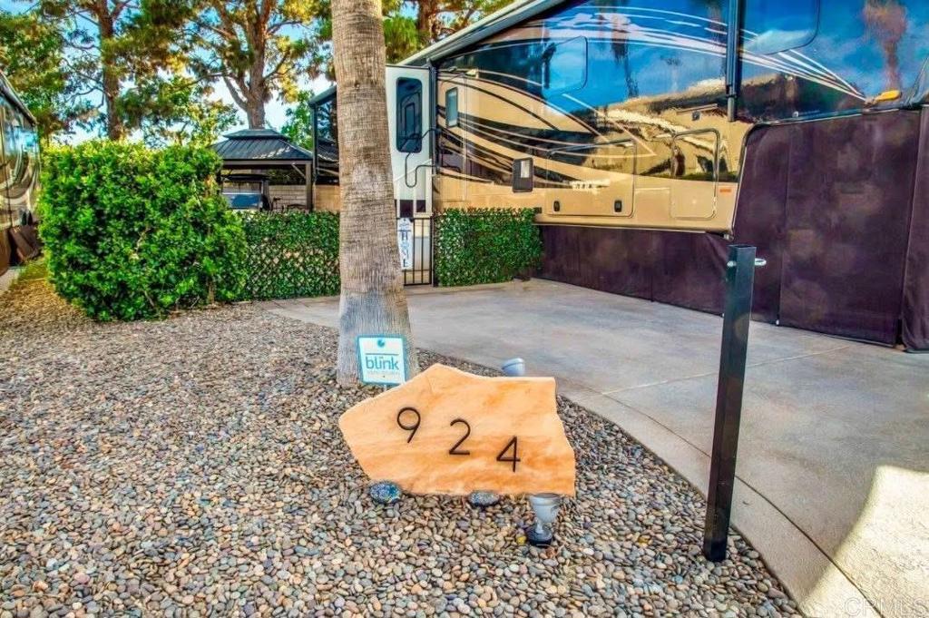 Lot 924, The south most wall of Outdoor Resorts offers privacy and afternoon shade. With a beautifully paved patio with kitchen, enjoy you spring evenings under the lit gazebo. The property is enclosed with high grade iron fencing. Outdoor Resort Palm Springs (ORPS) is a Guard Gated 5-Star RV Resort Community offering an active and luxurious lifestyle featuring golf (27 holes), tennis, pickleball, swimming and more! Two clubhouses, fitness center, beauty solan, La Roma Restaurant on campus, dog park and more!