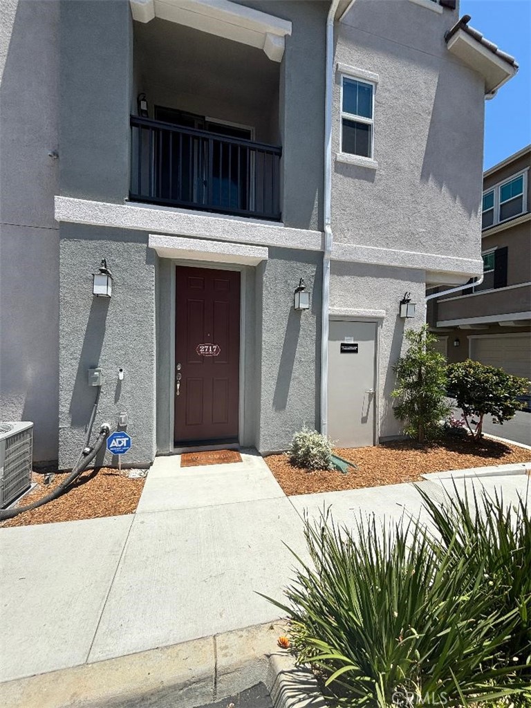 Location, location, location. This home has everything! Built in 2024. Corner unit, very short walk to the pool and tot lot. Energy Star-certified home with owned solar and electric vehicle charging outlet. Attached 2 car garage with upgraded overhead storage racks. Main Bedroom Suite has black out, remote controlled window coverings. Balcony sliding door has upgraded remote controlled window coverings. Upgraded Emerald Hollow vinyl plank flooring throughout main level and bathrooms. Upgraded carpeting and padding in bedrooms. Upgraded sinks throughout. Granite Kitchen counters with upgraded kitchen full height tile splash, Smart convection stainless steel range, cabinet pulls, faucet and upgraded stainless steel sink bowl. Upgraded self-closing kitchen trash cabinet. Upgraded recessed lighting. Ceiling fan prewired upgrades. Upgraded Flat-Panel TV prewired. ADT security system and Google Nest camera