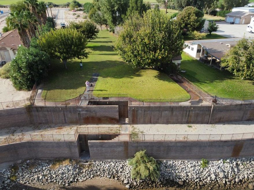 Rare Colorado Riverfront Opportunity! Two waterfront parcels being sold together, offering endless potential. These vacant lots sit directly on the Colorado River and are ready for your custom-built dream home, vacation retreat, or investment project. Enjoy stunning river and mountain views, direct water access, and the peaceful lifestyle only riverfront living can provide. The property also features 4 RV hookups with septic, perfect for guests or recreational use. Don't miss this chance to create your own private oasis on one of the most sought-after stretches of the Colorado River! Additional parcel included in sale is APN 869-240-034, for a total of 31,799 sq. ft..  Property is hooked up to city water and also has a well for irrigation.