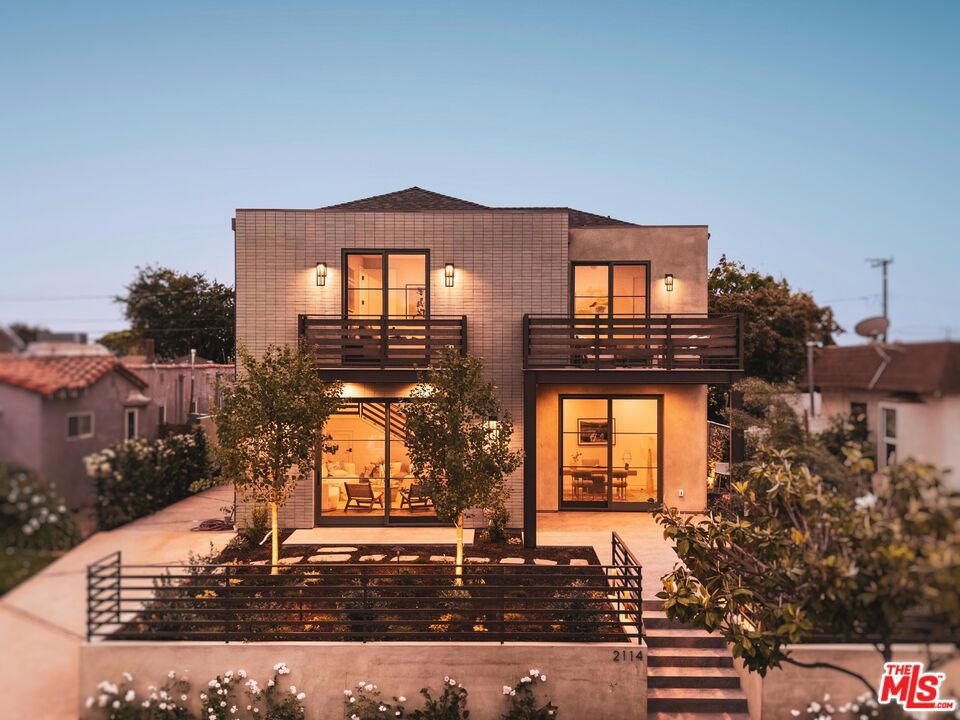 Perched at one of the highest points in Santa Monica's coveted Sunset Park, this brand-new architectural coastal contemporary home blends modern luxury with thoughtful design. The modernized J Charles architectural design main house features 5 bedrooms, 4.5 baths, soaring 10-foot ceilings, wide-plank hardwood floors, custom cabinetry, a gourmet kitchen with Thermador appliances, a Wolfe coffee maker, walnut built-ins, and a walk-in pantry. Entertain with ease in the open-concept great and family rooms, or unwind on the 320 sq ft roof deck with panoramic 360 views of the Santa Monica coastline and mountains. The primary suite is exceptionally spacious, featuring a walk-in maple wood closet and a spa-like ensuite bathroom with top-of-the-line finishes, dual vanities, a separate shower and soaking tub, and a private water closet. The additional bedrooms are generous in size and offer built-in closets finished with European oak. The detached ADU includes 2 bedrooms, 1.5 baths, a living room, kitchenette, and a private alley entrance, perfect for guests or rental potential. Additional features include solar panels, Lutron smart lighting, central audio, an alarm system, surveillance cameras, Kohler fixtures, and a wine fridge. The backyard offers space for a pool/spa installation at the buyer's request and cost. A rare opportunity for elevated living in one of Santa Monica's most sought-after neighborhoods. *7 Beds | 6 baths (5 Beds & 4.5 baths in the main house and 2 Beds & 1.5 baths in the ADU). 4,865 SqFt total. (3,845 SqFt. main house, 1000 SqFt. ADU).*