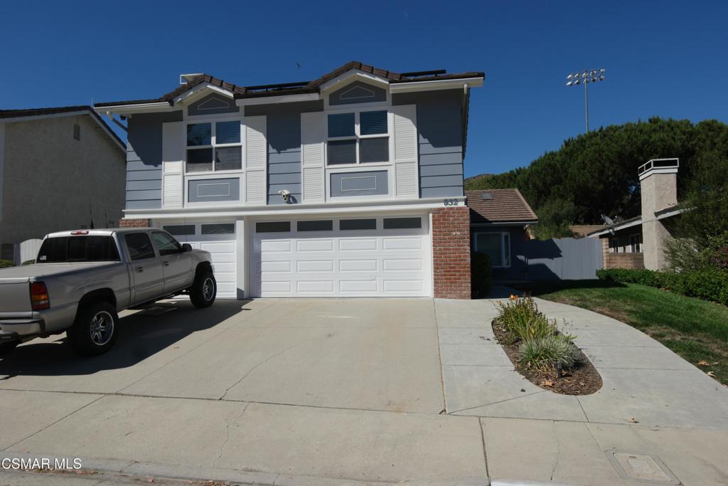 Welcome to this spacious and beautifully maintained 5-bedroom, 3-bath home in the heart of Newbury Park. This thoughtfully designed home features a desirable floor plan with one bedroom and a three-quarter bath conveniently located downstairs perfect for guests or a home office. Step into the large living room with vaulted ceilings and skylights that fill the space with natural light. The formal dining area is ideal for entertaining, while the upgraded kitchen boasts stainless steel appliances, a generous center island with breakfast bar, and plenty of counter space. The adjacent family room offers a cozy fireplace and a built-in wet bar perfect for relaxed evenings at home. Upstairs, you'll find an oversized primary suite with a large walk-in closet and a beautifully updated en-suite bathroom featuring dual vanities and a luxurious soaking tub. Three additional spacious bedrooms, a hall bath with newer vanity and fixtures, and a bonus room with its own fireplace provide plenty of room for family and flexibility. Additional highlights include a three-car garage, central air conditioning, and a beautifully landscaped backyard with a covered patio perfect for outdoor dining and entertaining. Located near scenic parks, hiking and biking trails, shopping, and award-winning schools, this home offers the best of Newbury Park living.