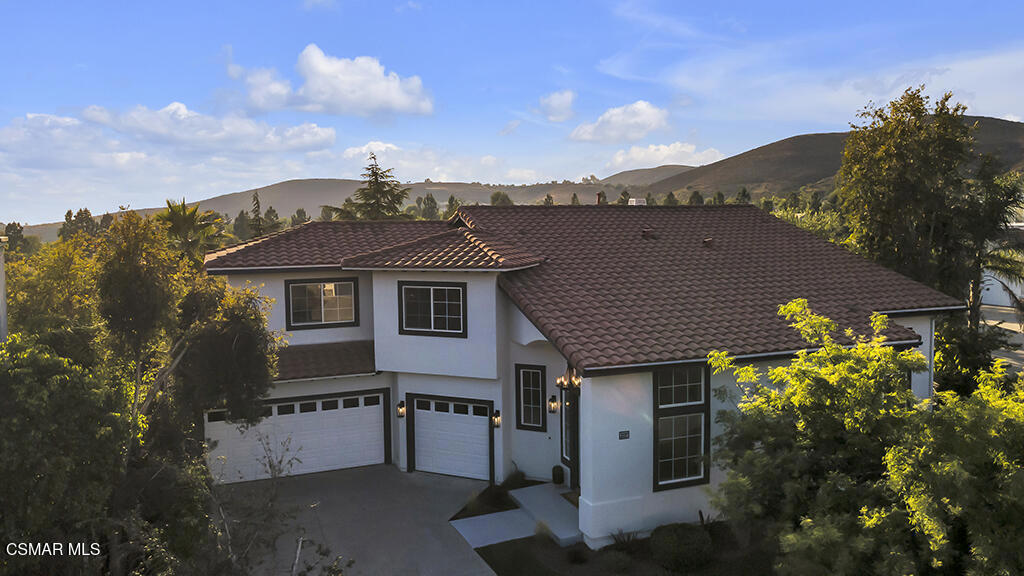 Exquisite Custom Home in The Summit at Lang Ranch! Welcome to this absolutely stunning, fully remodeled masterpiece nestled in the highly sought-after community with no HOA's. Pictures do not do it justice. From the moment you step through the grand double doors onto rich hardwood floors, you're greeted with soaring vaulted ceilings and an open layout designed for luxurious living and unforgettable gatherings. Step into the inviting family room, dining area, and kitchen--a seamlessly connected space designed for everyday comfort and memorable gatherings.At the heart of the home is the gourmet chef's kitchen, featuring brand-new Thermador appliances, sleek quartz countertops with a gorgeous full slab backsplash, and an oversized center island perfect for gathering, working, or enjoying casual meals. The kitchen opens directly into the spacious family room, creating a warm and welcoming atmosphere the entire family will love. From here, head outside to your private backyard oasis--a stunning outdoor retreat featuring a custom-built BBQ, newly refinished pool and spa, and sweeping canyon views. Whether hosting friends or enjoying quiet evenings, you'll love the sunsets and tranquil ambiance, all framed by drought-tolerant landscaping designed for beauty and low maintenance. On the main level, you'll find a versatile office or fifth bedroom, a 3/4 bathroom, and a generous laundry room with both gas and electric dryer hookups. Enjoy peace of mind with a brand-new roof backed by an 8 year warranty, all new copper plumbing and dual zone AC. Upstairs, retreat to your custom-designed primary suite--a true sanctuary featuring a massive walk-in closet and a spa-inspired bathroom with an oversized shower, dual vanities, a makeup station, and a deep relaxation tub you have to see to believe. Three additional bedrooms and a full bath complete the second floor, offering flexibility for a large or growing family, guest rooms, or a dedicated playroom/game room. This home truly has it all--every detail has been carefully curated, and no expense was spared in creating this one-of-a-kind residence. Located in an award winning school district, do not miss the opportunity to own this turn key property in one of the area's most sought after communities.