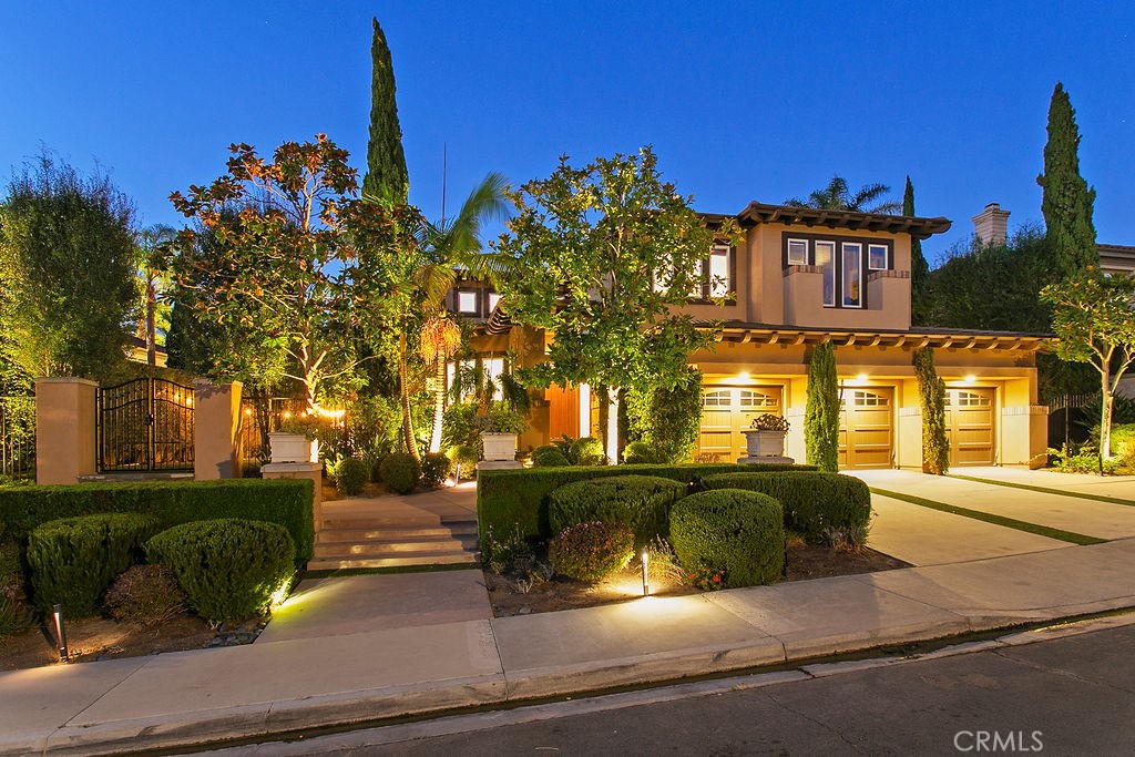 This magnificent 4-bed, 3.5-bath home, in guard-gated Ocean Ranch, delivers a harmonious blend of luxury and tranquility, the 4,005 sq ft estate captivates the moment you enter. A majestic foyer opens to elegant living and dining areas, with bespoke wall treatments, a warm fireplace, and tranquil views of the backyard and pool. Vaulted ceilings in the living room invite natural light, while the dining room’s coffered ceiling and adjustable lighting sets the mood. The remodeled gourmet kitchen showcases a generous island, breakfast bar, imported porcelain flooring, tailored cabinetry, and a Wolf gas range. A bright, inviting breakfast alcove features large windows and distinctive pendant lighting. The adjoining family room, highlighted by an angled fireplace and a chic wet bar, seamlessly integrates with the open layout—creating a perfect backdrop for memorable gatherings. The main floor also offers an en-suite bedroom, powder room, and a spacious laundry room for ultimate convenience. Two staircases—a graceful main staircase and a functional secondary one—ascend to the upper level, where a versatile bonus room and two additional bedrooms share a luxurious bathroom. The primary suite extends across the home’s full width, with a two-sided fireplace, expansive sitting area and a scenic balcony. The lavish, oversized bathroom boasts a freestanding tub, shower, and under-lit Onyx stone cabinetry. In addition to abundant closet space, the primary suite also includes a separate, custom built, floor-to-ceiling, handbag and shoe closet. Outdoors, the oversized lot offers two beautifully curated yards ideal for entertaining. The backyard is a tropical paradise, with a radiant pool and spa that includes a cascading waterfall, fire features, and an outdoor pavilion. This structure, a focal point for outdoor entertainment, features a media center, wet bar, refrigerator, dishwasher, ice maker, and a built-in BBQ. Verdant landscaping creates a serene retreat. Finally, a 3-car garage comes equipped with a Tesla charger, storage, and a wine cellar. Located just 1.5 miles from Salt Creek Beach, Dana Point Harbor, Monarch Beach Golf Links, the Ritz Carlton, and Waldorf Astoria, this home offers easy access to shopping, dining, and great schools. Fully furnished with designer décor, this distinctive estate will certainly appeal to the most discriminating tenants. It includes regular housekeeping, plant care, gardener, and pool service. Contact us today for a private showing!