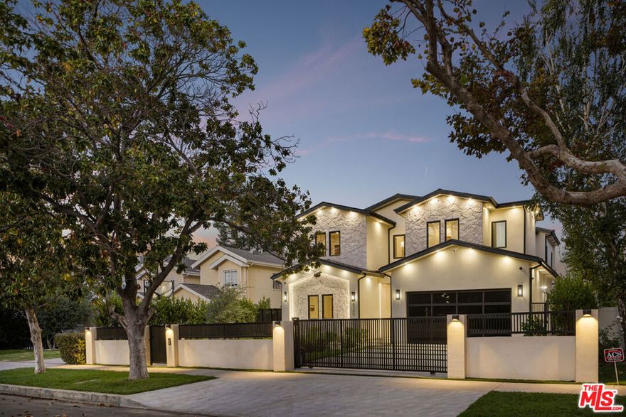 Introducing 4140 Sunnyslope Ave - a striking, modern farmhouse tucked behind gates South of the boulevard in the heart of Sherman Oaks. Thoughtfully crafted with exceptional attention to detail, this custom-built 5-bedroom, 5-bathroom main residence is complemented by a fully permitted detached ADU, offering versatility and modern convenience. Passing through the formal entryway, the chef's kitchen is a true showpiece, appointed with Thermador appliances, rich walnut cabinetry, and a large center island. Designed for seamless entertainment in mind, the kitchen flows effortlessly into the living room, where a sleek fireplace, custom built-ins, and floor-to-ceiling glass stacking doors create an inviting indoor-outdoor lifestyle. The lower level includes a spacious en-suite bedroom or office, powder bath, and a dedicated laundry room. Upstairs, four additional ensuite bedrooms await, highlighted by the serene primary suite. The primary oasis is complete with its own fireplace, private balcony, custom built-ins, and a generous walk-in closet, offering endless luxury and functionality. The spa-inspired bath offers dual floating vanities, a soaking tub nestled on a bed of rocks, and a step-in shower with three shower heads for the ultimate indulgence. The backyard is an entertainer's dream, evoking a private resort with a sparkling pool and spa, outdoor kitchen with built-in BBQ, expansive deck for al-fresco dining, and an Optoma projector and screen for unforgettable movie nights under the stars. The ADU at 4138 Sunnyslope Ave includes a kitchenette and full bath - perfect for a pool house, guest suite, office, or potential income property. Additional features include a Control4 smart home system and a two-car garage. Located within the coveted Dixie Canyon Community Charter School district and just moments from The Shops at Sportsman's Lodge and the vibrant offerings along Ventura Boulevard, this residence embodies the perfect balance of modern sophistication and everyday ease.