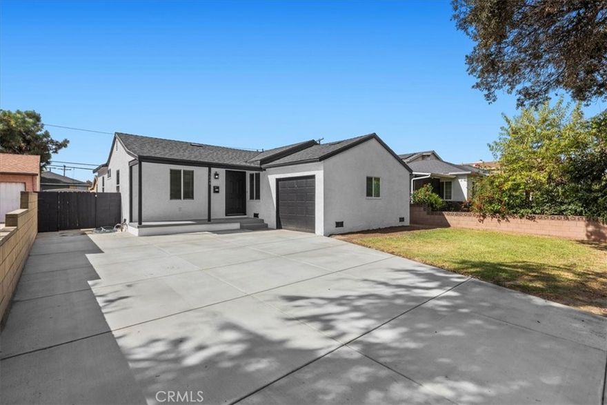 Completely remodeled and ready to impress, this single-level, 3-bedroom, 2-bath residence offers modern comfort in a classic Pico Rivera neighborhood.  Curb appeal begins with a newly poured concrete driveway, fresh exterior paint, and a welcoming entryway. Inside, natural light illuminates the open living area with smooth finishes and crisp vinyl flooring. The reimagined kitchen pairs white shaker cabinetry with granite countertops, stainless steel appliances, and abundant prep space. Three generous bedrooms provide versatility that is ideal for guests, a home office, or a growing household. Both bathrooms have been recently updated with new tile, vanities, and sleek black hardware.  Two energy-efficient mini-split A/C units help to keep this home comfortable year-round. The private backyard with a patio and grassy lawn creates an easy-care, outdoor retreat.  Close to Whittier Blvd, the 605 & 5 FWYs, parks, and local dining, this home blends style, convenience, and value.