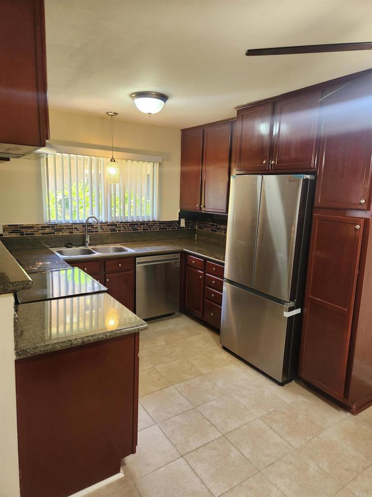The Best Value in San Diego County! Perfect for first time home buyers and investors! Centrally located in a small community, this beautifully updated 2 bedroom ground floor unit is ready for it's new owner. Fresh paint and porcelain tile flooring throughout. Gorgeous updated kitchen with granite counters, tile backsplash, and newer stainless appliances(less than 1 yr old). Large open living room and dining area. Both bedrooms are spacious and bright. The large full bath is beautifully updated with newer fixtures. HOA pays for water and trash, and the central water heater provides hot water for community. Community laundry on site as well as a lovely grassy play area. Pets are permitted. Ideally located, unit is just a short walking distance to Lindo Lake, grocery store, shopping center, Lakeside Rodeo Grounds, lots of local restaurants and bars, and El Capital High School