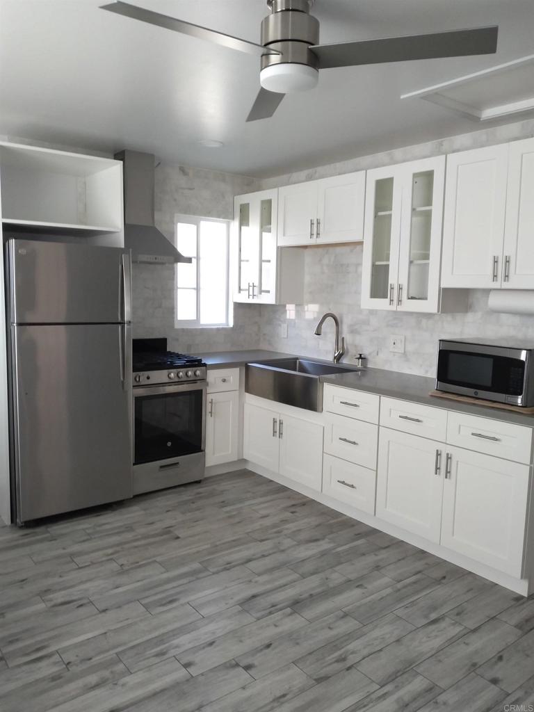 Attached guest house available for rent July 1, 2025. This fully renovated 1 bedroom, 1bathroom unit is located in the Seven Oaks 55+ community. The unit has upgraded appliances, stackable washer/ dryer, a private backyard entrance, and street parking. Utilities are included and HOA amenities are available. Must see in person to appreciate!