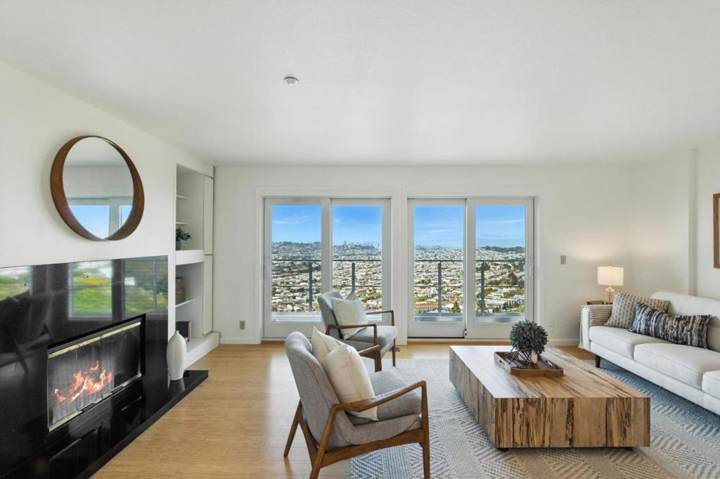 Perched atop the hills of Daly City in the exclusive gated community of Pointe Pacific, this spacious 2 BR, 2 BA condo with a versatile den offers unobstructed panoramic views of the SF skyline, city lights & unforgettable sunsets. Step inside to a thoughtfully designed layout featuring a step-down living room with a private balcony providing the perfect vantage point to soak in the stunning vistas. The separate dining area & eat-in kitchen offer both functionality & comfort for everyday living. The primary suite boasts sweeping views, dual closets & an en-suite bath with double vanity. An updated kitchen equipped with granite countertops & stainless steel appliances is ready for your culinary pursuits. Other features include bamboo flooring, fresh paint & carpet, in-unit laundry, one-car detached garage & a dedicated parking space. Residents enjoy access to HOA amenities including a sauna, gym & clubhouse. Recent community-wide upgrades including a new roof, gutters, siding, exterior paint, windows & sliding doors enhance both comfort & long-term value. Ideally located just minutes from SF with convenient access to BART, SFO & major freeways, this home combines the tranquility of hillside living with unmatched urban accessibility. Experience incredible value, space & views!
