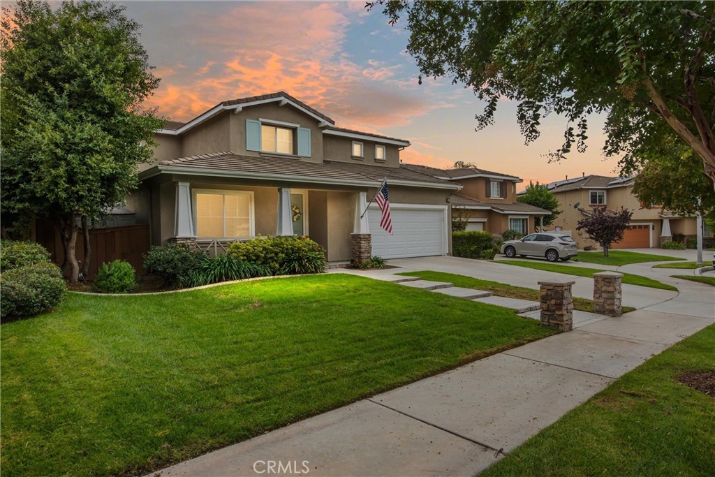 Welcome to University Grove, a highly sought-after neighborhood known for its quiet streets and charming community feel. Nestled in a peaceful cul-de-sac, this beautifully maintained 4-bedroom, 2.5-bathroom home offers the perfect blend of comfort, functionality, and modern upgrades.
Step through the front door into a spacious and inviting living room, featuring a large custom cabinetry unit perfect for entertaining or relaxing with family. Continue down the hallway to a cozy sitting room featuring a gas fireplace, ideal for quiet evenings or hosting guests. The open-concept kitchen is the heart of the home, boasting an enormous center island and a spacious breakfast nook—a perfect spot to start your day. A bead board wrapped kitchen island and newly upgraded tile backsplash serve as versatile backdrops to complement a variety of aesthetic designs.
The downstairs also includes a convenient half bathroom and a laundry room with additional storage.
Upstairs, you'll find the generous primary suite, along with three additional spacious bedrooms—all wired for high-speed internet, making remote work or home learning a breeze. A shared full bathroom with dual vanity serves the secondary bedrooms. The upstairs hallway also features a built-in desk space with cabinetry, ideal for homework, crafts, or working from home.
Outdoor living is just as impressive, with a large patio perfect for dining, lounging, or entertaining, and an open grass lawn—great for kids, pets, or simply enjoying your private backyard oasis. There is also a charming swing set included, perfect for children and families to create lasting memories.
Additional features include a 3-car garage, a new garage door as well as custom garage cabinetry with work bench for additional convenience and storage.