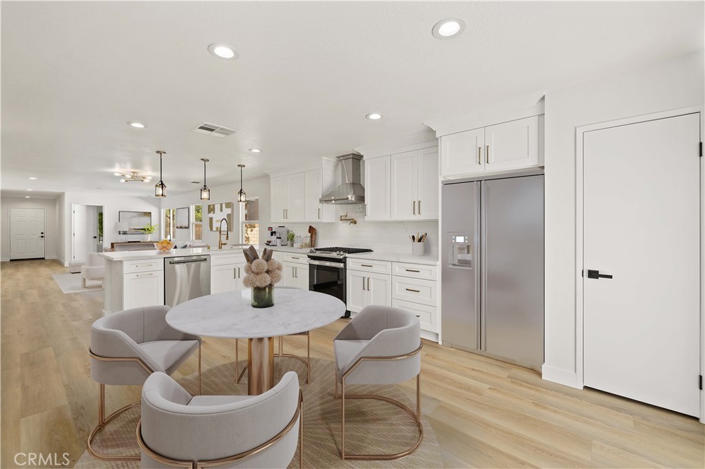Kitchens are where Memories are Made, Make Yours Beautiful!! Discover your dream home in this completely renovated single-story gem nestled on a sprawling quarter-acre lot! This stunning four-bedroom, two-bathroom residence showcases 1,720 square feet of thoughtfully designed living space that's perfect for creating lasting memories. The heart of this home is the spectacular kitchen, where culinary dreams come to life. Feast your eyes on brand-new GE stainless steel appliances, including a powerful gas range with continuous edge-to-edge cooktop and spacious 5.3 cubic foot oven. The whisper-quiet dishwasher with Steam-Sani cycle makes cleanup a breeze, while the luxury ZLINE range hood with champagne bronze accents adds professional flair. A smooth brushed bronze retractable pot filler brings convenience right to your fingertips, and the sleek Moen pulldown faucet with Power Clean technology delivers exceptional performance. Elegant Shaker cabinets paired with stunning Calacatta Roma countertops create a timeless aesthetic that flows seamlessly throughout the kitchen and bathrooms. The understated elegance speaks volumes about quality craftsmanship and attention to detail. Fresh vinyl plank flooring and new carpet enhance the comfort throughout this single-story layout. The fourth bedroom currently serves as a versatile office space, offering flexibility for your unique needs. Step outside to your private oasis! The completely landscaped front and rear yards provide endless possibilities for outdoor entertainment and relaxation. The expansive backyard offers plenty of room for family fun while leaving ample space for that future pool you've been dreaming about. Convenience meets comfort with nearby amenities including public transportation, shopping at ALDI, recreational opportunities at Tierra Bonita Park, and train access. This fresh listing won't last long in today's market!