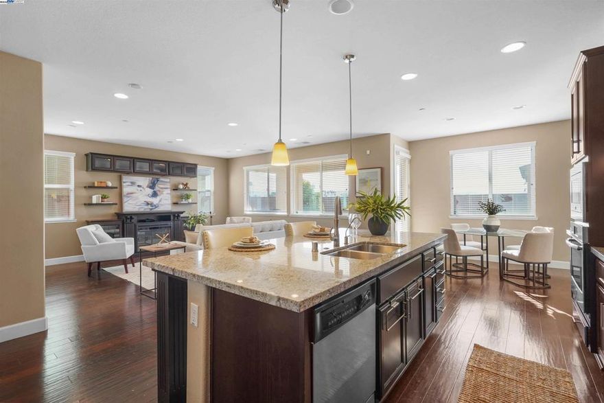 Welcome to 2417 Stalsburg Dr. in Tracy’s desirable Ridgerton community—a beautifully upgraded home with over $130K in enhancements and no front or rear neighbors! Built in 2015, this spacious home offers a rare first-floor bedroom and full bath, perfect for guests or multi-gen living. Enjoy builder upgrades including covered patio, upgraded cabinets, countertops, backsplashes, premium appliances (fridge, washer & dryer), a water softener and a reverse osmosis under the kitchen sink and upgraded hardwood flooring. The owner has added stunning stained concrete, stone landscaping, a large gazebo, and entertainment & wine cabinets. Owned solar and stylish window blinds add long-term value. The low-maintenance front yard and entertainer’s backyard are perfect for gatherings with fire pit, turf, and multiple seating areas. Inside, enjoy a cozy fireplace, built-in entertainment center, and dedicated office spaces ideal for remote work. The large tandem garage offers extra space for storage or hobbies. This home blends comfort, style, and convenience—don’t miss it!