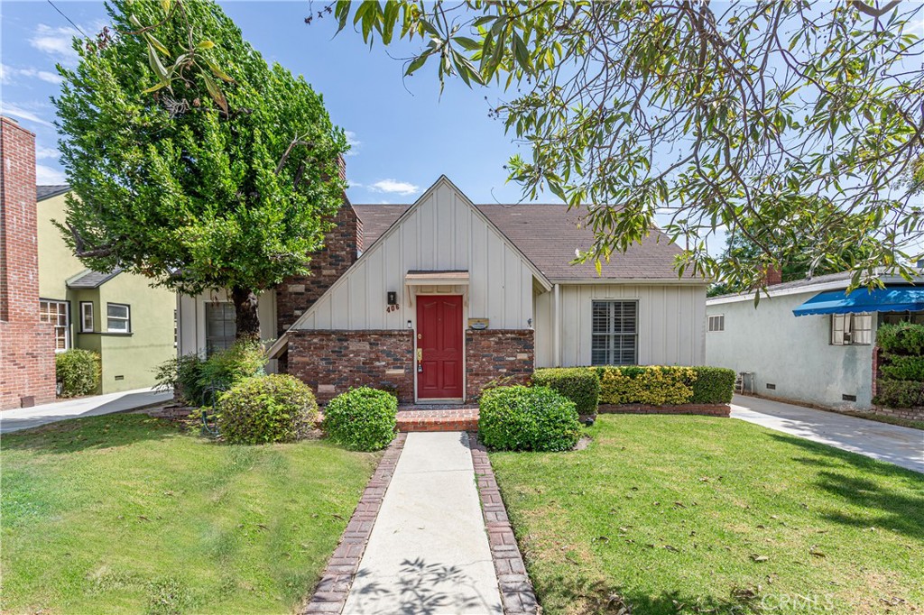 Welcome to this charming three-bedroom, two-bath home located in Burbank’s highly desirable Rancho neighborhood. From the moment you arrive, the storybook curb appeal catches your eye—brick and siding details, a vibrant red front door, and mature landscaping create a warm and inviting first impression. Inside, the sunlit living room showcases hardwood floors, custom wood shutters, and a cozy fireplace that sets the tone for comfortable living. The kitchen has been thoughtfully updated with granite counters, a stylish backsplash, crisp white cabinetry, and a mix of modern appliances, blending convenience with timeless style. The expansive family room is the true showstopper. With vaulted ceilings, exposed beams, a dramatic fireplace, and a wall-sized picture window framing views of the backyard, it’s the ultimate gathering space—perfect for entertaining or relaxing at home. The primary suite features a custom built-in closet, while the additional bedrooms offer flexibility for guests, family, or a home office. Both bathrooms are tastefully updated, including a spa-like main bath with dual vessel sinks and a glass-enclosed shower. Outdoors, enjoy a large private yard shaded by mature fruit trees, a covered patio ideal for al fresco dining, and a detached two-car garage providing ample parking and storage. With central A/C & heat and thoughtful updates throughout, this home blends character, comfort, and convenience. Beyond the property, the Rancho neighborhood is one of Burbank’s most coveted communities. Known for its tree-lined streets, equestrian charm, and close-knit feel, it’s just minutes from Disney, Warner Bros., and NBC studios. Griffith Park and the Los Angeles Equestrian Center are practically in your backyard, offering endless outdoor recreation, horse trails, and scenic spots to explore. Families appreciate the highly rated Burbank schools, while local cafés, shops, and dining options give the area its vibrant, welcoming energy. This home offers not just a place to live, but a lifestyle rooted in comfort, character, and the best of Burbank’s Rancho living.