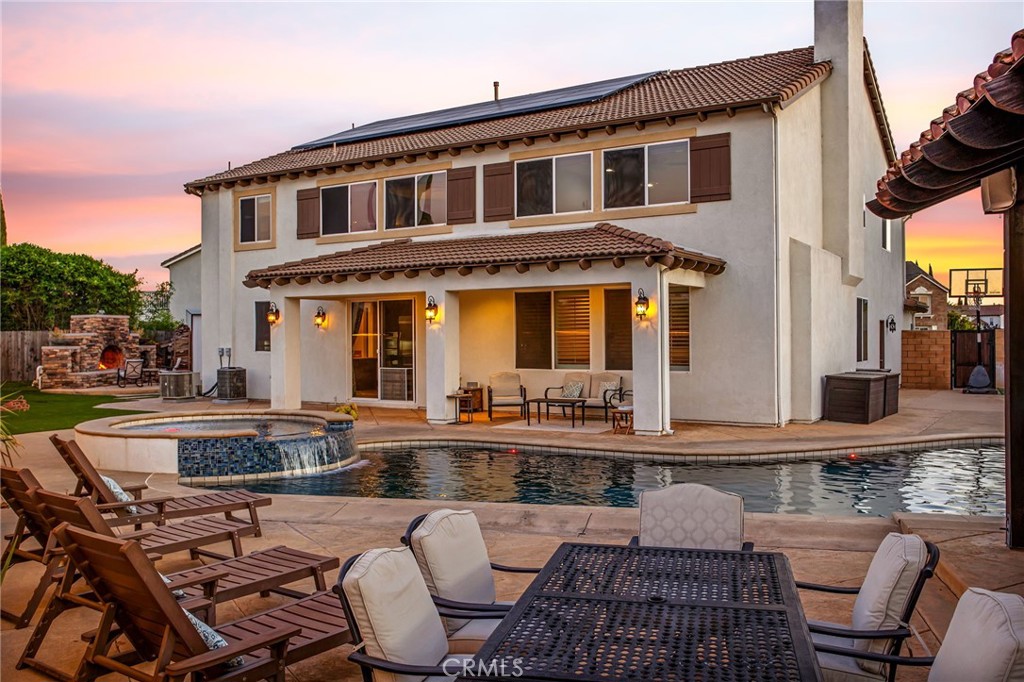 Just Listed! Dream Backyard Oasis in Morgan Hill – 5 Beds, 4 Baths + Loft + Pool + Outdoor Kitchen! Welcome to 34098 Hartwell Court – a show-stopping estate located at the end of a quiet cul-de-sac in the highly sought-after Morgan Hill community of Temecula. This stunning 5-bedroom, 4-bathroom home offers over 4,000 sq ft of beautifully designed living space and delivers the perfect blend of elegance, comfort, and resort-style amenities. From the moment you arrive, the curb appeal sets the tone—manicured landscaping, a charming entry, and 3-car garage welcome you home. Step inside to soaring ceilings, rich wood floors, and an expansive formal living area that flows seamlessly into a wide open layout. The gourmet kitchen is an entertainer’s dream, featuring a large center island, granite countertops, stainless steel appliances, butler’s pantry, and extended dining area that opens to a spacious family room with cozy fireplace. Downstairs offers a private bedroom and full bath—ideal for guests or multigenerational living. Upstairs you’ll find an oversized loft perfect for a game room, movie night, or home gym. Four additional spacious bedrooms include a luxurious primary suite with a retreat/office area, custom walk-in closet with built-ins, and a spa-inspired bath featuring a soaking tub, oversized walk-in shower, dual sinks, and a dedicated vanity station. Step into your backyard paradise—this outdoor space is next-level! Enjoy a sparkling saltwater pool and spa, a massive built-in BBQ island with bar seating, fridge, sink, and a covered prep area, plus a cozy firepit and an outdoor fireplace that make every evening feel like a getaway. The large side yard provides even more room to roam, play, or garden. Additional highlights include SOLAR, 3-car garage, and access to Morgan Hill's resort-style amenities: clubhouse, fitness center, pool/spa, playgrounds, and walking trails. All conveniently located near top-rated schools, wine country, shopping, and dining. This is more than a home—it’s a lifestyle. Don’t miss your chance to own one of the finest properties in South Temecula!