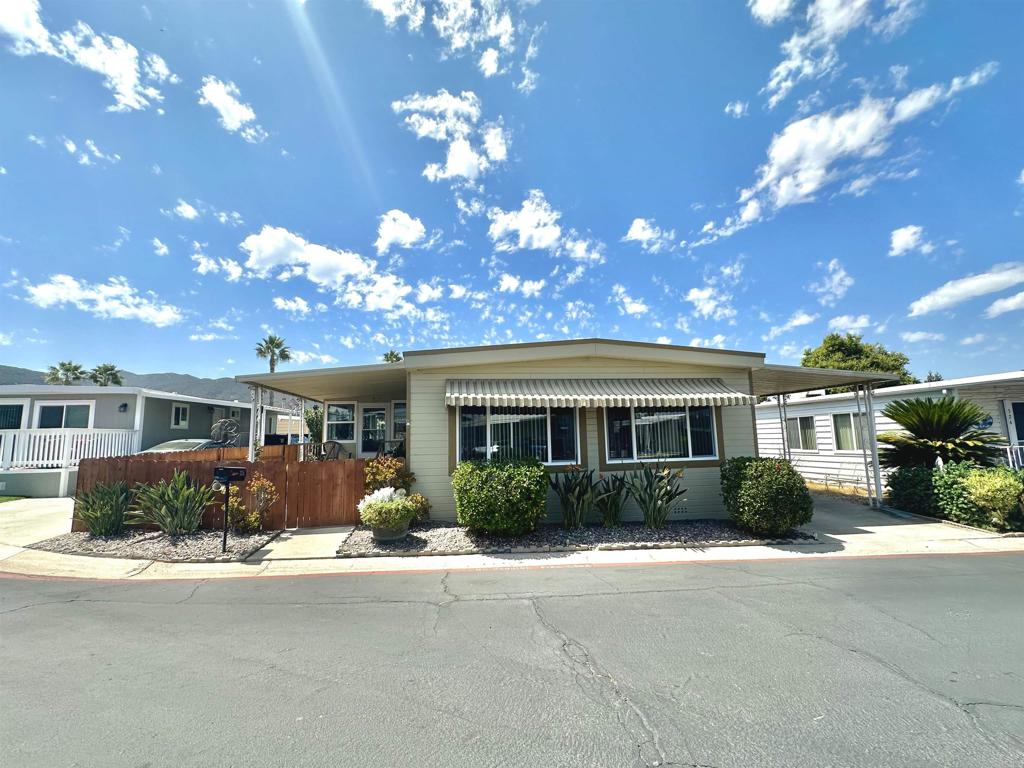 Santee living at its finest! This 2 bedroom, 2 bath home has 1440 square feet of living space. You’ll enjoy this updated and move-in-ready home. New duel pane windows throughout, a newer furnace and air-conditioning unit less than three years old. The kitchen features updated appliances, such as stove top, oven and dishwasher. The outdoor space is meticulously landscaped with an automatic drip system and newly remodeled sunroom featuring dual pane windows and storm doors. Pride of ownership shines throughout. Meadowbrook offers a wealth of amenities, such as a sparkling pool, relaxed Jacuzzi, billiards, game rooms, library, and a vibrant clubhouse. The clubhouse serves as the communities, social hub hosting events, like potlucks, bingo, craft days, yoga sessions, and game nights – fostering a warm community minded environment. Don’t miss the opportunity to make this delightful residence your new home in a friendly, active community designed for your enjoyment! Close to shopping, hiking, Pickleball and Parks. With its resort like feel-Meadowbrook has it all!