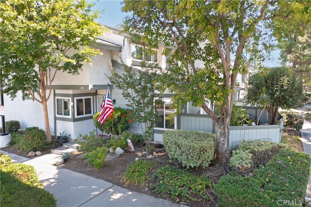 BRANDYWINE VILLAGE TOWNHOME END UNIT - This beautifully maintained and updated home features 3 bedrooms, 3 bathrooms with approx. 1,345 Sq Ft of living space. Step inside to find fresh new paint, stylish tile flooring, and an inviting living room complete with a cozy fireplace—perfect for relaxing or entertaining. The dining area offers room for a large table for family and friend gatherings. The galley style kitchen offers tile countertops, wood cabinets, new gas range and dishwasher. The spacious primary suite features an ensuite bathroom with a walk-in closet, and plenty of natural light, creating your own private retreat. The additional bedrooms are generously sized, ideal for family, guests, or a home office. Enjoy modern amenities throughout, along with a private patio that extends your living space outdoors. Two car attached garage with laundry. Nestled in a well-maintained community, Brandywine Village offers a welcoming neighborhood feel with pool, tennis courts and conveniently located near schools, shopping, entertainment, dining, airport and major freeways.